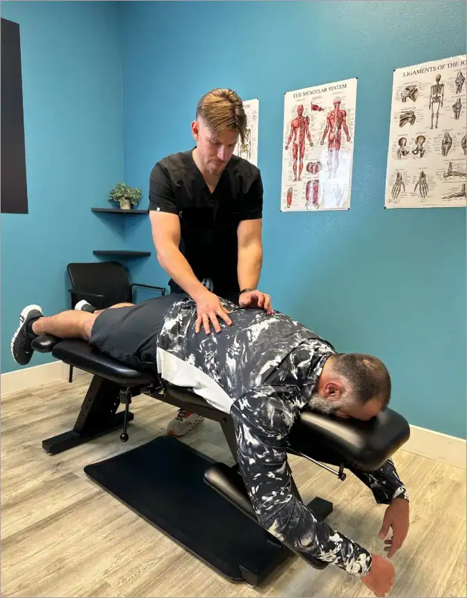 A professional chiropractor performing chiropractic treatment to relieve sciatica symptoms.