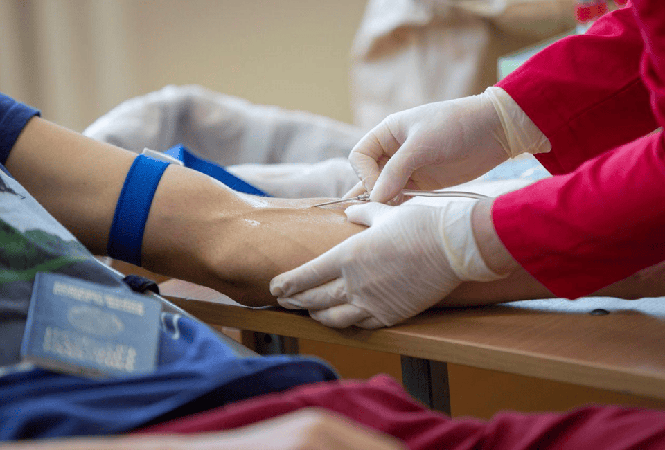 Nurse monitoring IV drip in a modern Scottsdale clinic during vitamin infusion with emphasis on patient safety and medical supervision.