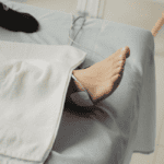 Illustration showing electrical nerve stimulation reducing pain signals from damaged feet affected by peripheral neuropathy.