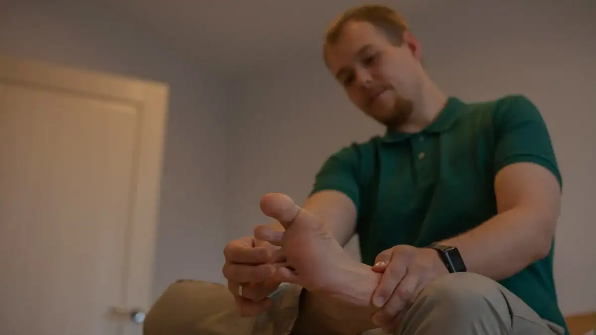 Healthcare provider examining a patient's foot during a diabetic neuropathy assessment