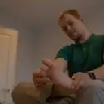 Healthcare provider examining a patient's foot during a diabetic neuropathy assessment